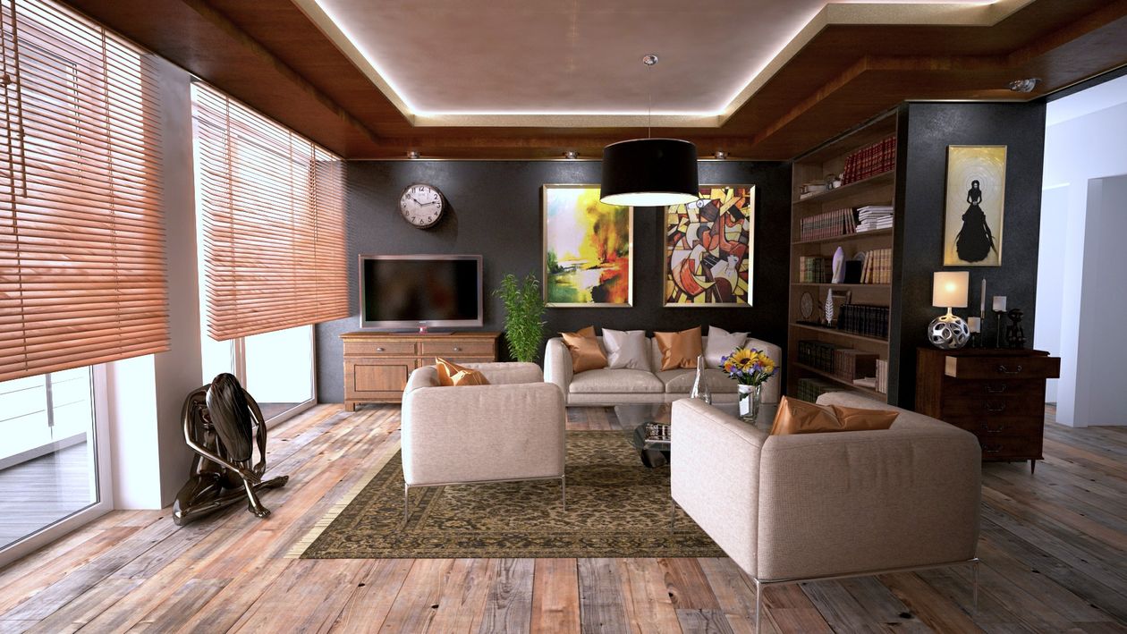 A real estate agent guides an interested couple through a bright and modern home, showcasing the benefit of expert guidance during a home tour.